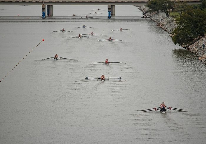 Boat racing on the Oklahoma River at the Boathouse District, home to Riversport OKC’s paddling venues